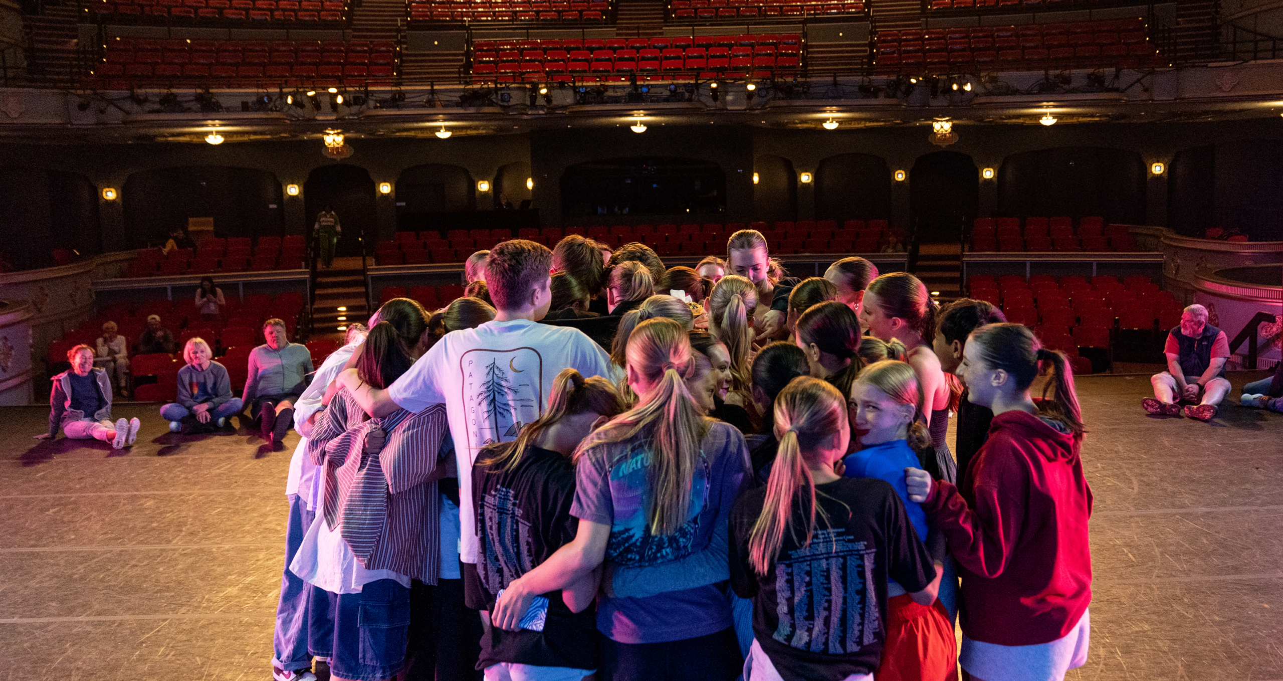 MOL dancers group hug on the Overture Center stage